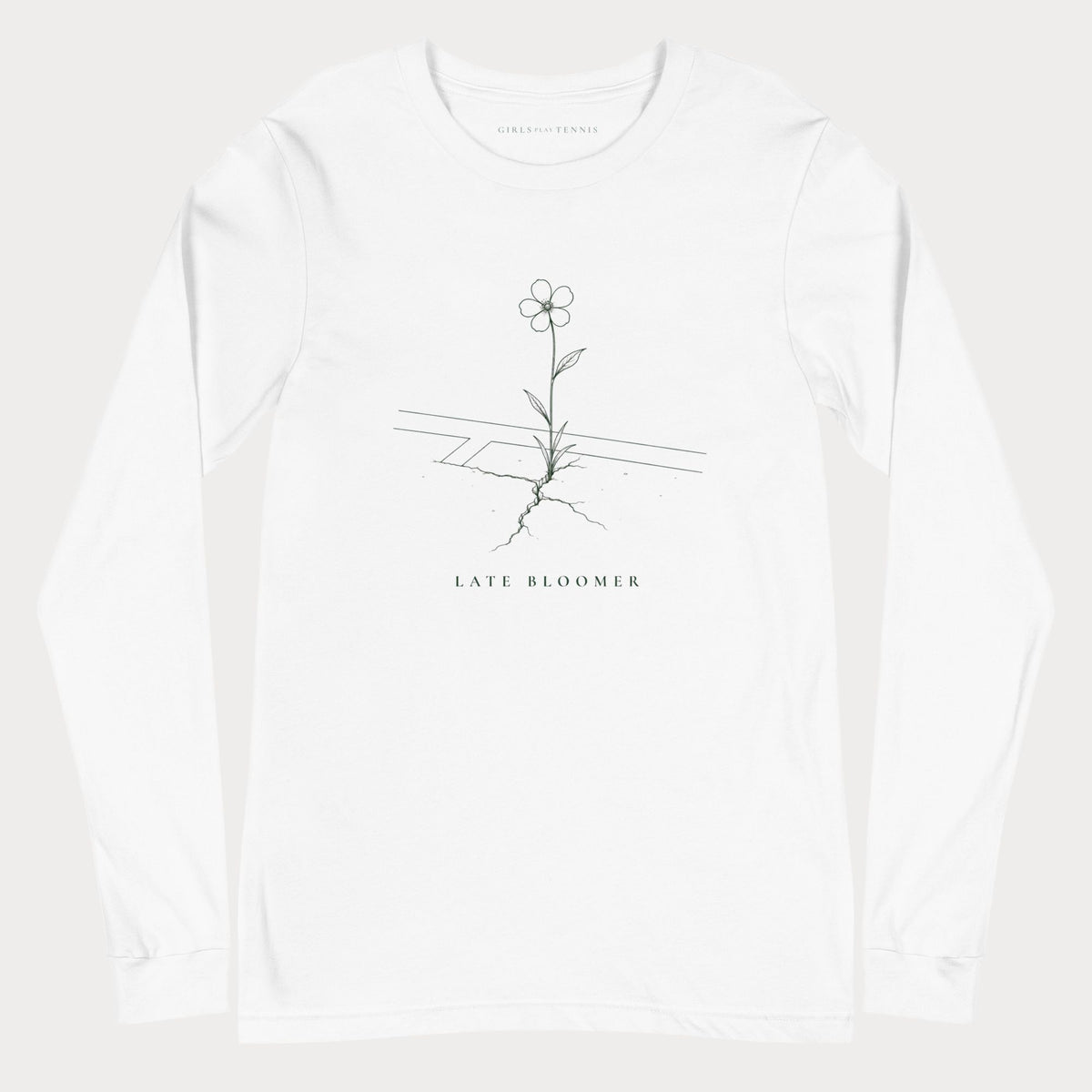White Late Bloomer women's tennis long-sleeve T-shirt with a line drawing of a flower growing through a crack in a court line