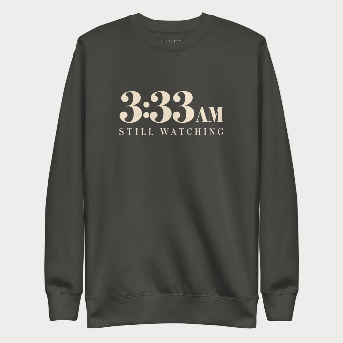 Vintage black 3:33 AM women's tennis crewneck sweatshirt with cream lettering reading 3:33 AM above Still Watching