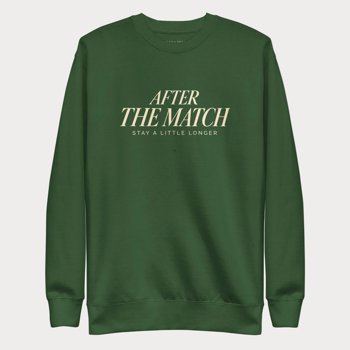 Forest green After the Match women's tennis crewneck sweatshirt with cream lettering reading After the Match above Stay a Little Longer