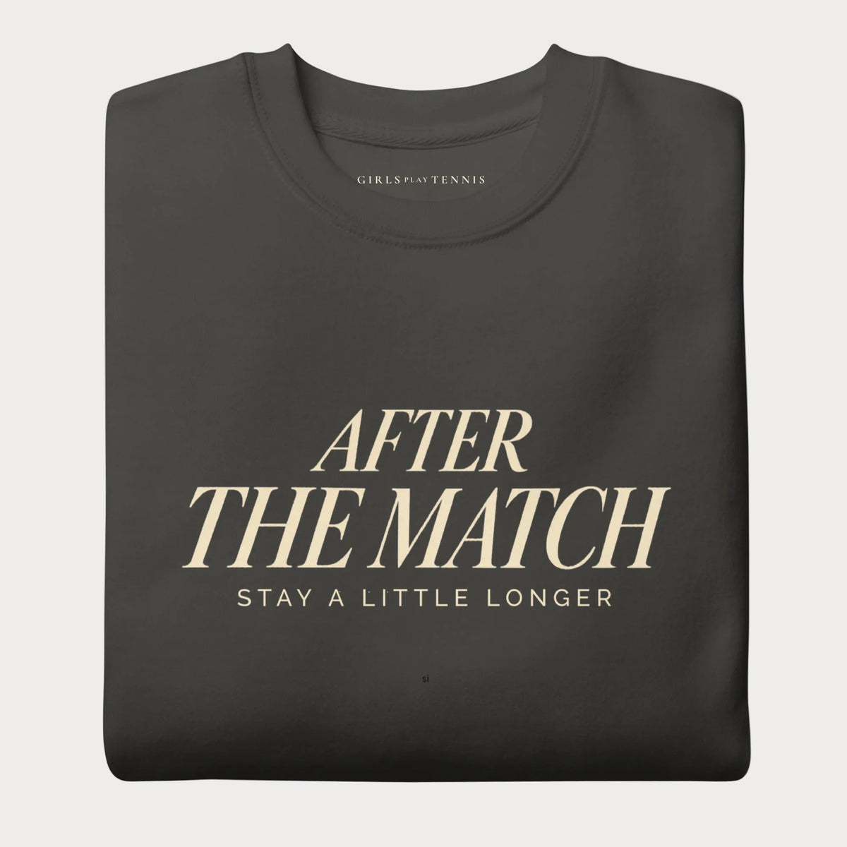 Folded vintage black After the Match women's tennis crewneck sweatshirt with cream lettering reading After the Match above Stay a Little Longer