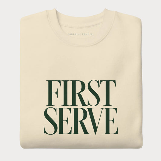 Folded bone First Serve women's tennis crewneck sweatshirt with stacked forest green capitals reading First Serve