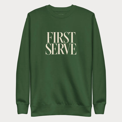 Forest green First Serve women's tennis crewneck sweatshirt with stacked cream capitals reading First Serve