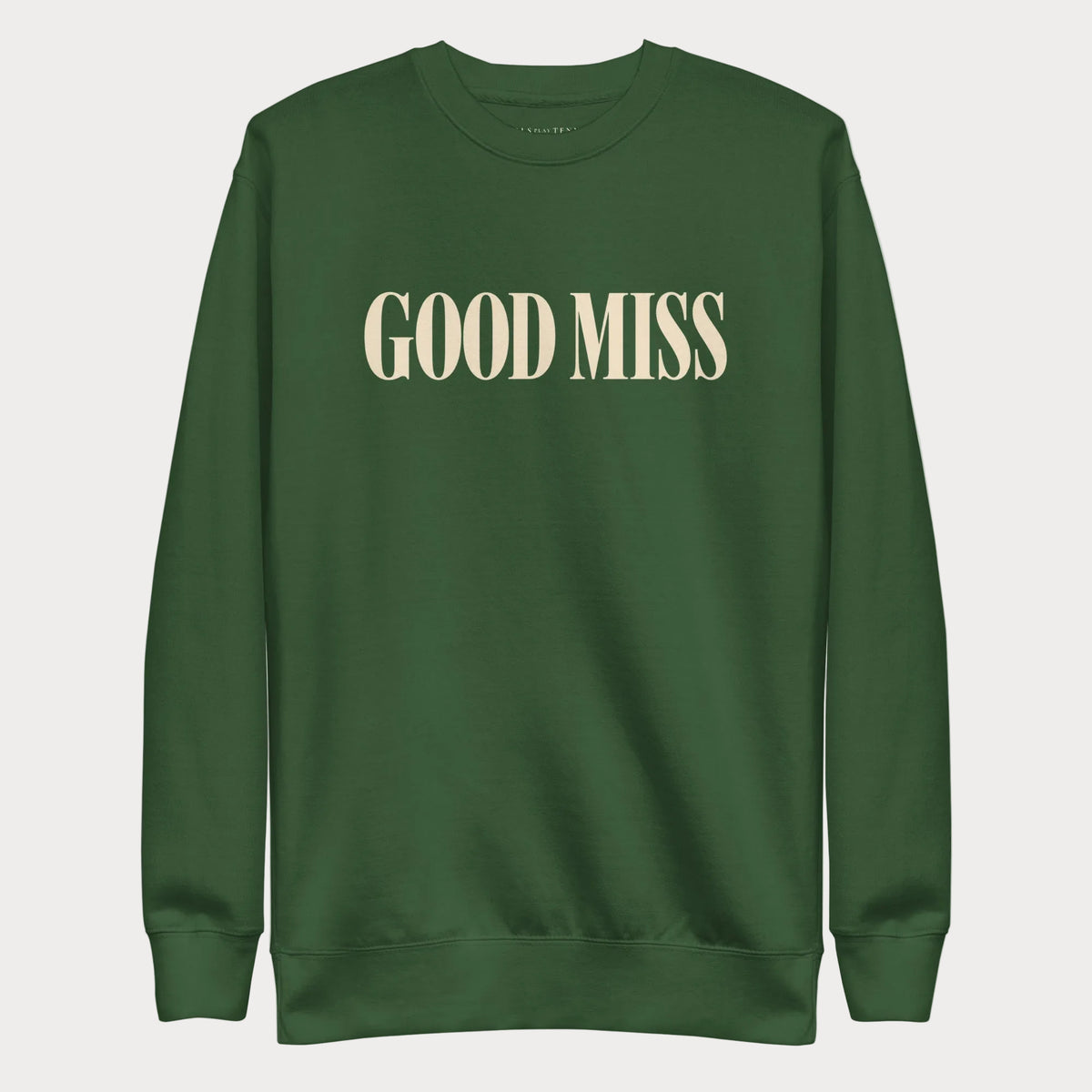 Forest green Good Miss women's tennis crewneck sweatshirt with tall cream capitals reading Good Miss