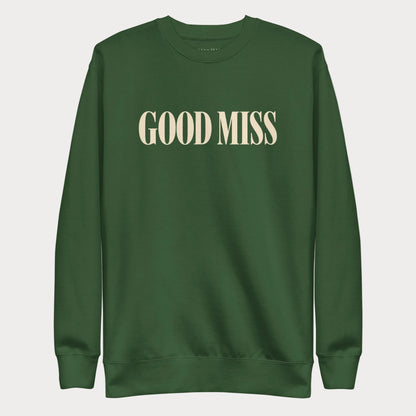 Forest green Good Miss women's tennis crewneck sweatshirt with tall cream capitals reading Good Miss