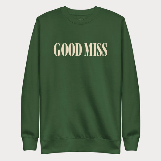 Forest green Good Miss women's tennis crewneck sweatshirt with tall cream capitals reading Good Miss