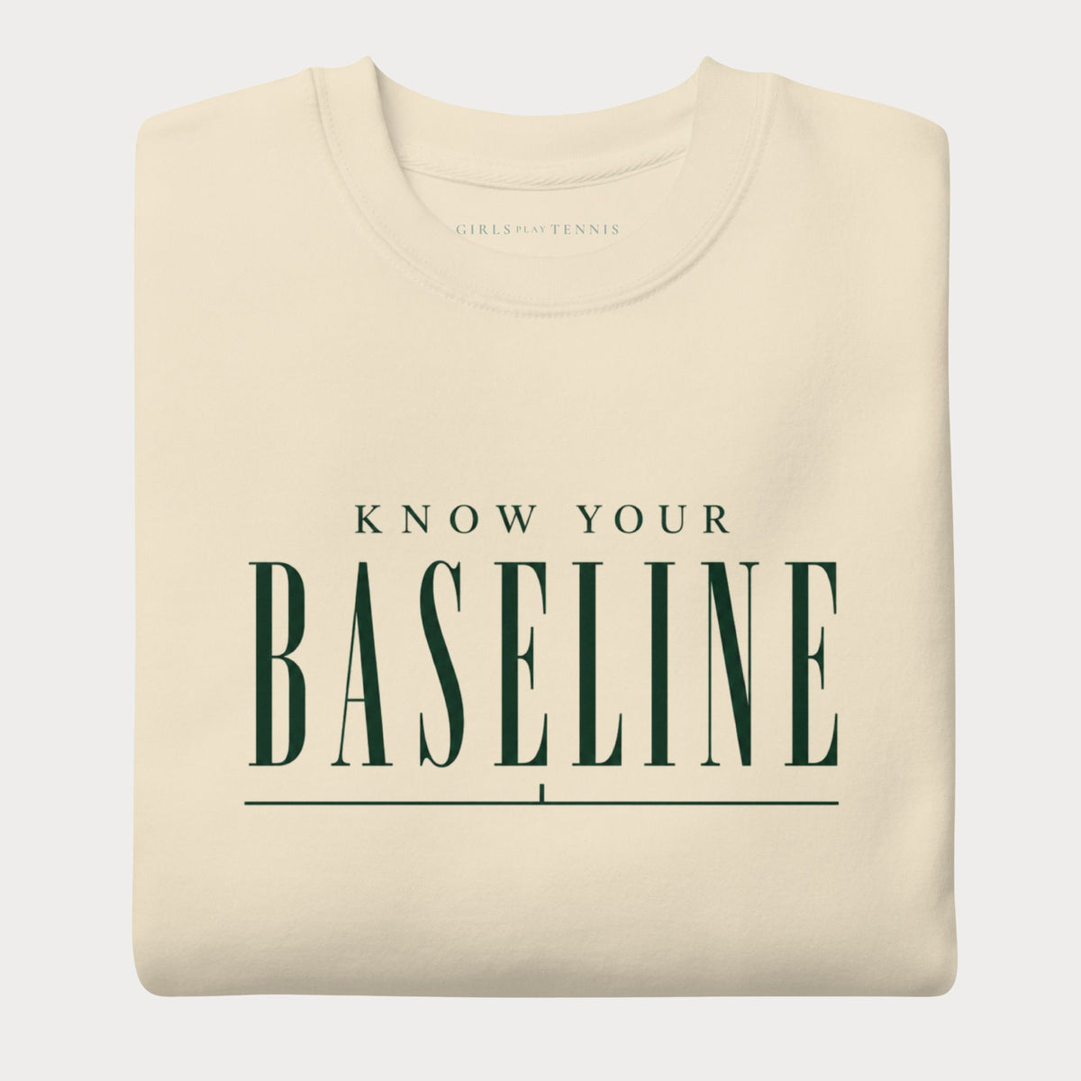 Folded bone Know Your Baseline women's tennis crewneck sweatshirt with forest green lettering reading Know Your Baseline above an underline rule