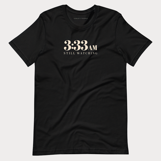 Black 3:33 AM women's tennis T-shirt with cream lettering reading 3:33 AM above Still Watching