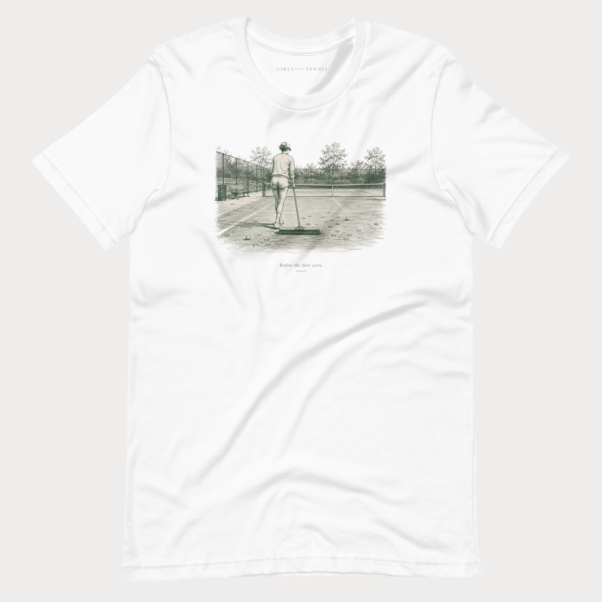 White Before the First Serve women's tennis T-shirt with a pen-and-ink illustration of a person brushing a tennis court with a large broom