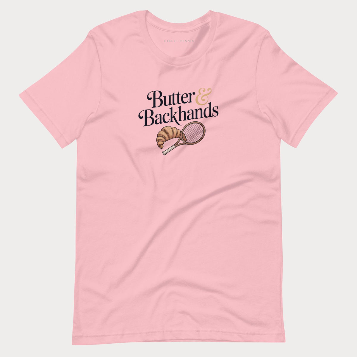 Pink Butter & Backhands women's tennis T-shirt with a croissant and tennis racket graphic