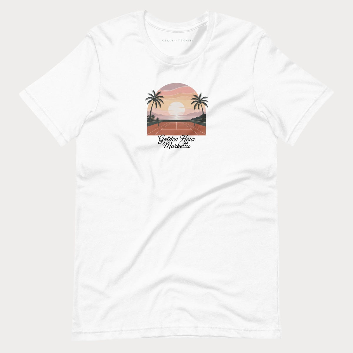 White Golden Hour Marbella women's tennis T-shirt with a sunset over a clay court framed by palm trees