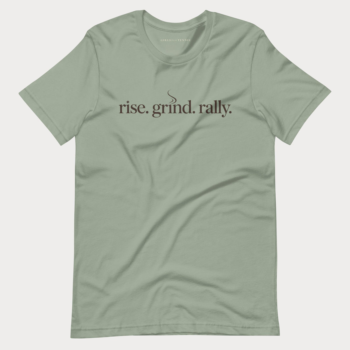 Sage green Rise. Grind. Rally. women's tennis T-shirt with lowercase lettering and a small steam curl