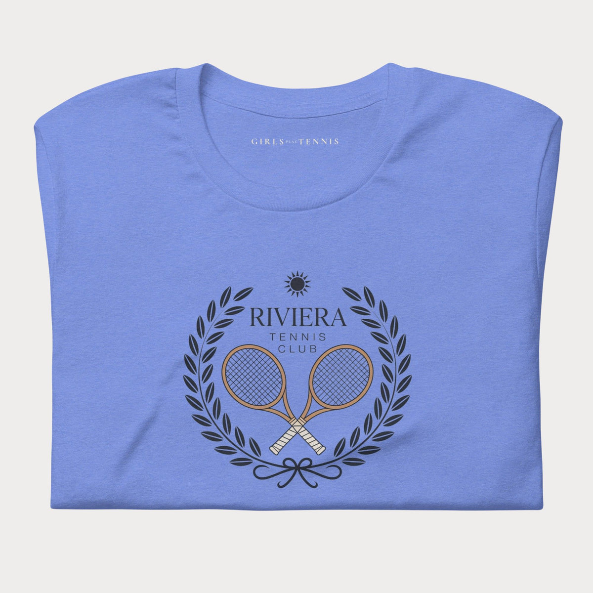 Folded blue Riviera Tennis Club women's tennis T-shirt with a laurel wreath and crossed rackets