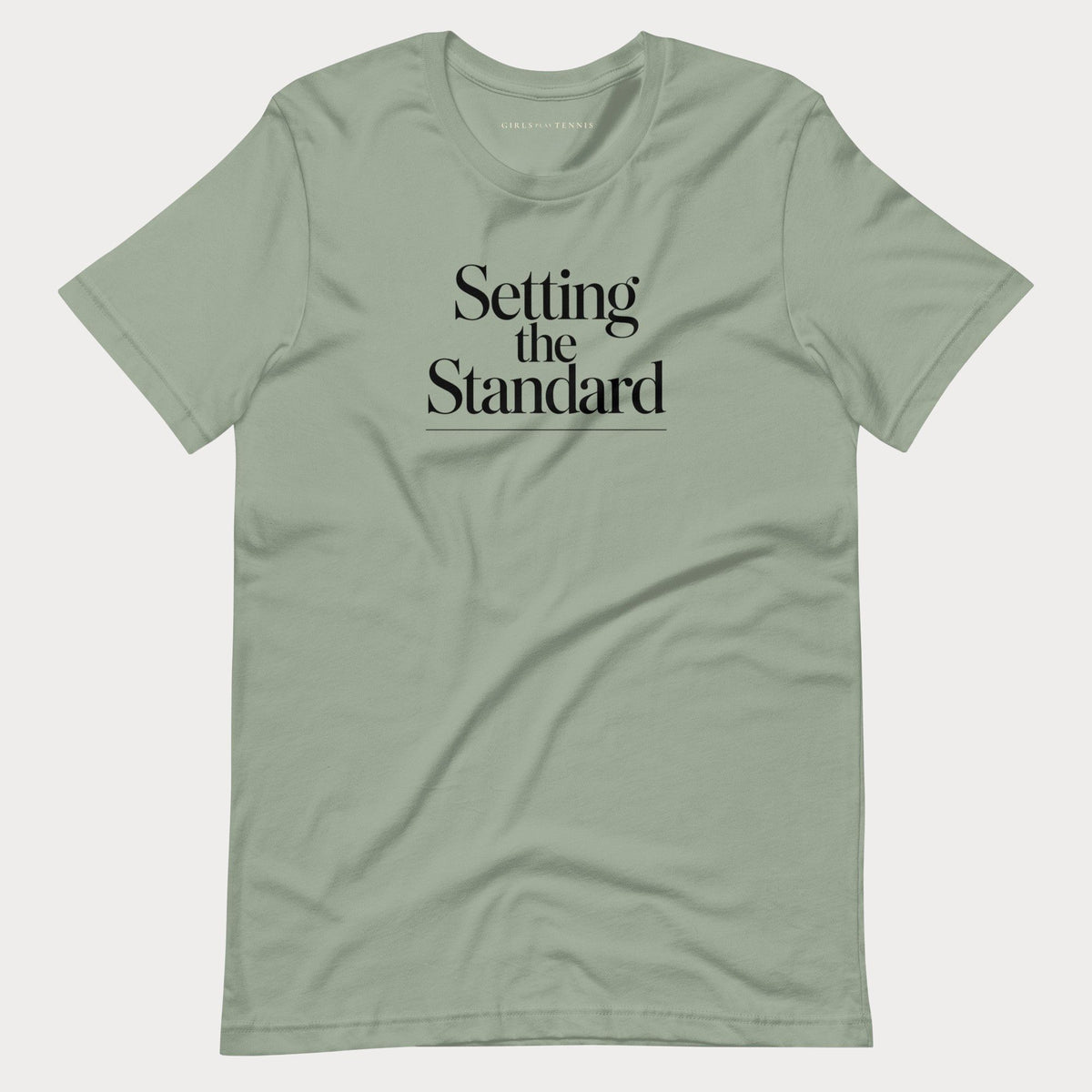 Sage green Setting the Standard women's tennis T-shirt with stacked serif lettering and a thin underline