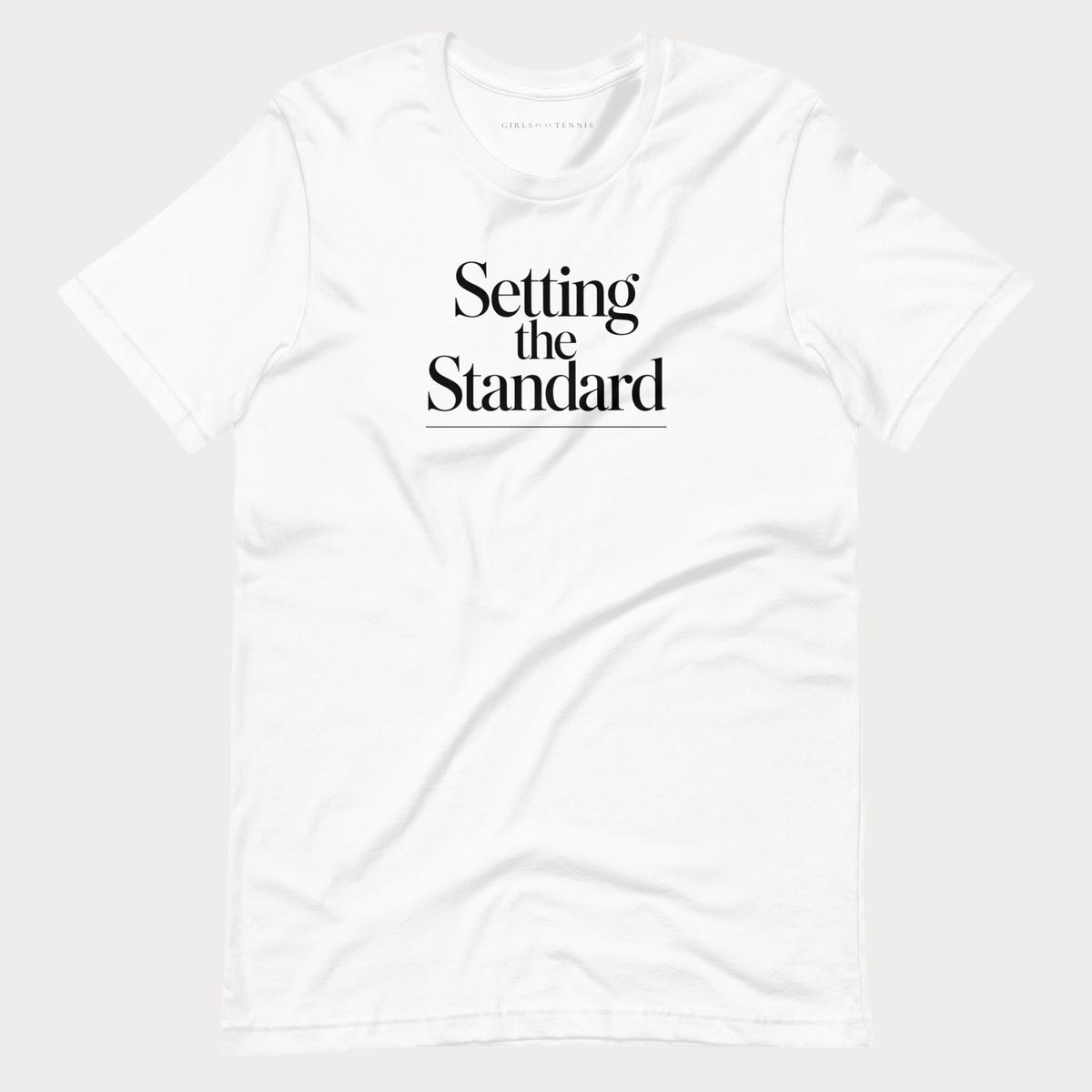 White Setting the Standard women's tennis T-shirt with stacked serif lettering and a thin underline
