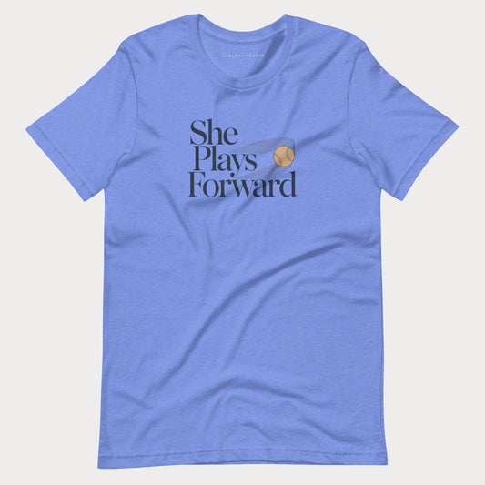 Blue She Plays Forward women's tennis T-shirt with stacked lettering and a motion-blurred tennis ball