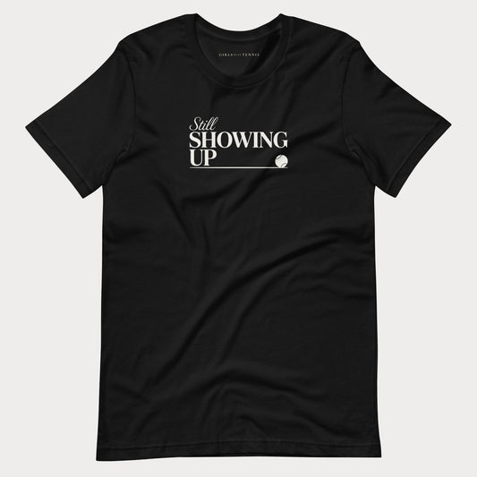 Black Still Showing Up women's tennis T-shirt with white lettering and a progress line ending in a tennis ball