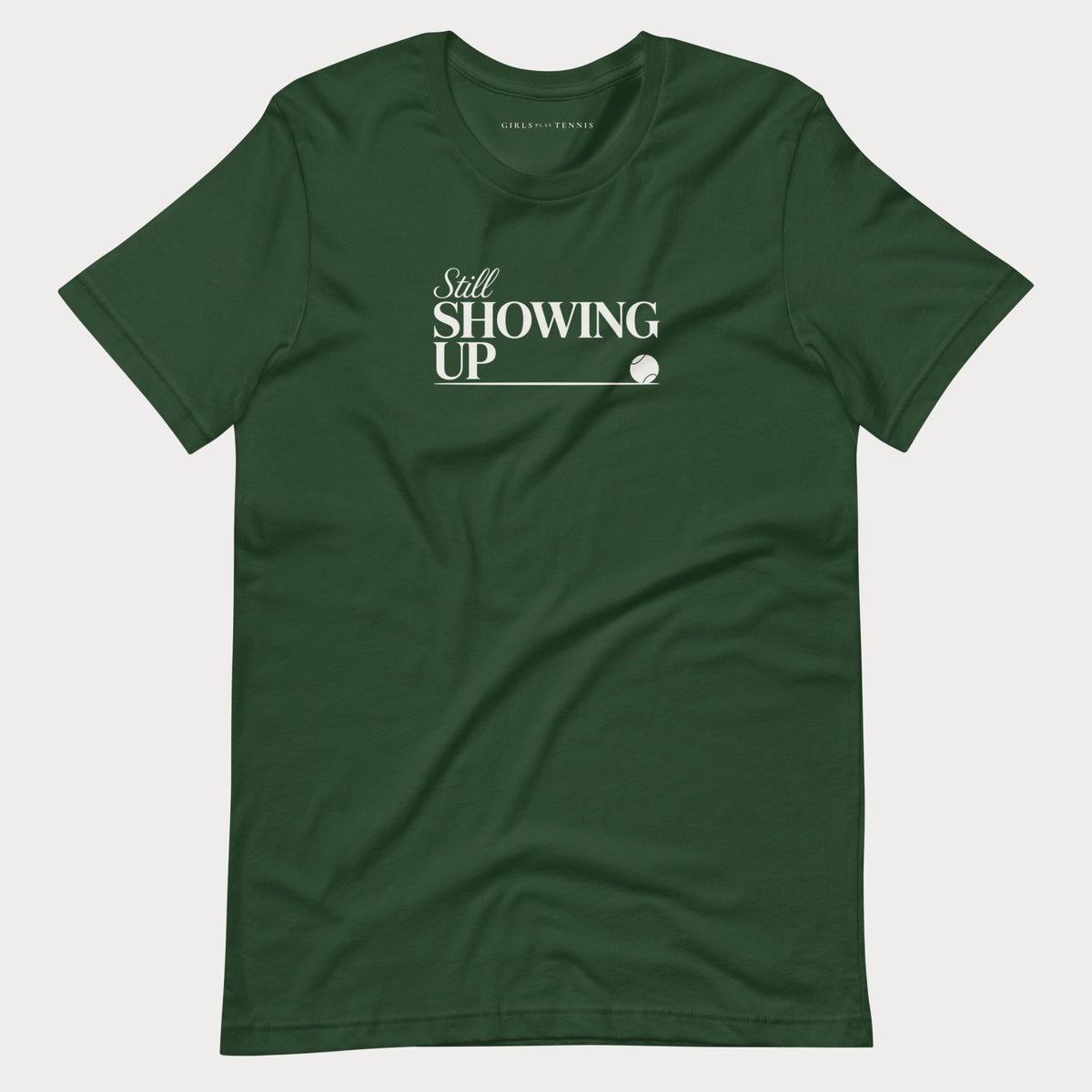 Forest green Still Showing Up women's tennis T-shirt with white lettering and a progress line ending in a tennis ball