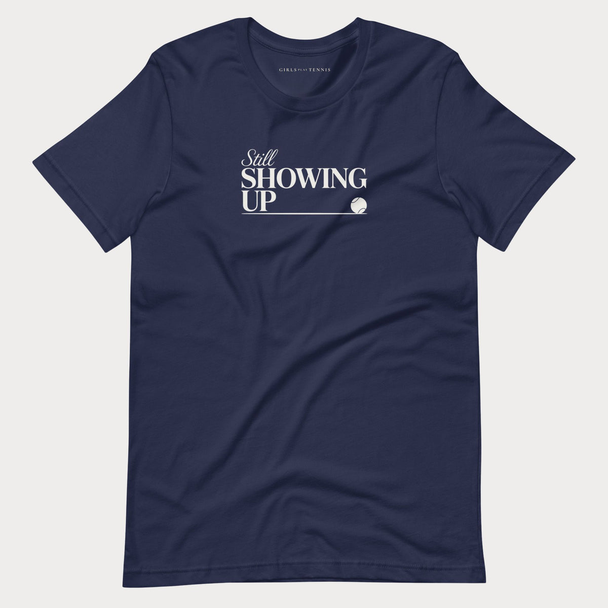 Navy Still Showing Up women's tennis T-shirt with white lettering and a progress line ending in a tennis ball
